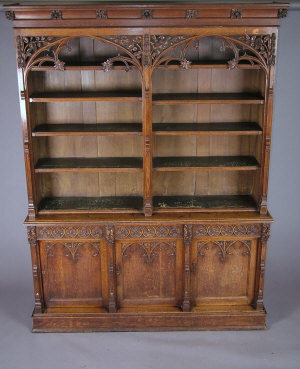 Appraisal: A Victorian carved oak Gothic revival bookcase mid th century