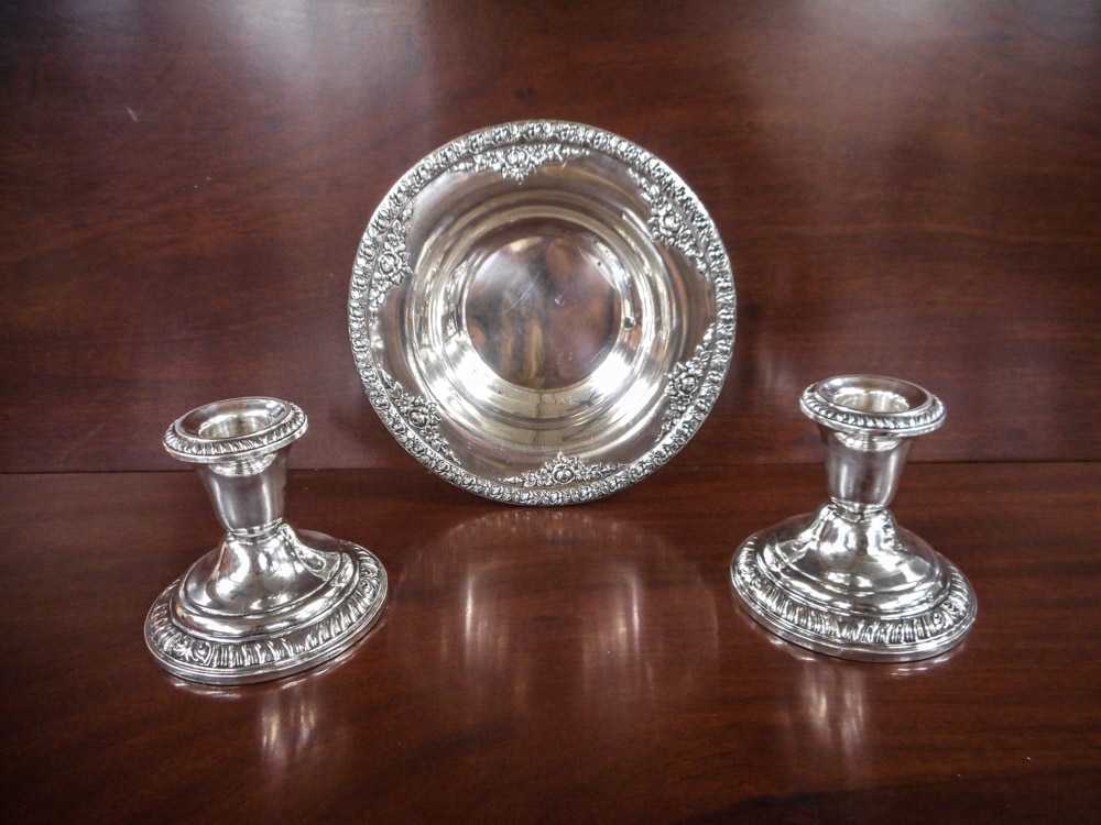 Appraisal: PAIR OF STERLING SILVER CANDLESTICKS AND A BOWL the candlesticks