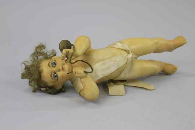 Appraisal: WAX CHRISTMAS ANGEL All poured wax angel cherub with trumpet