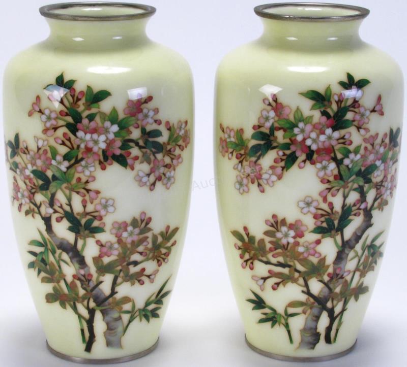 Appraisal: Pair of Japanese Enameled Vases enameled metal vases cream field