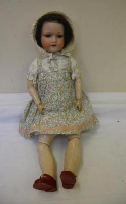 Appraisal: An Armand Marseille bisque head girl doll with blue glass