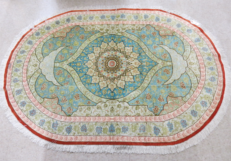 Appraisal: A CONTEMPORARY PERSIAN SILK AREA RUG hand knotted oval shape