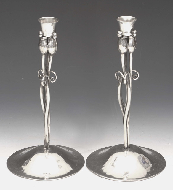 Appraisal: A pair of Nekrassoff Art Nouveau pewter candlesticks the central