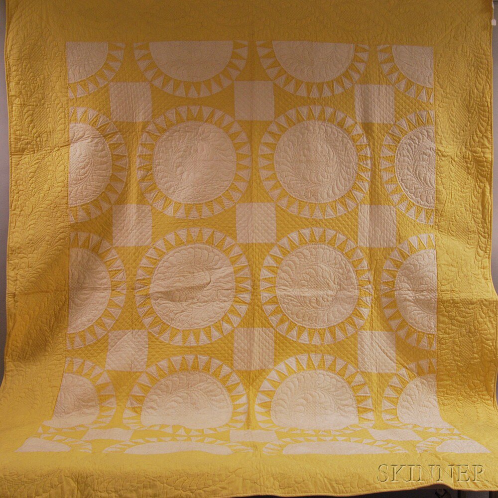 Appraisal: Yellow and White Pieced Cotton Quilt with Sun Pattern Estimate