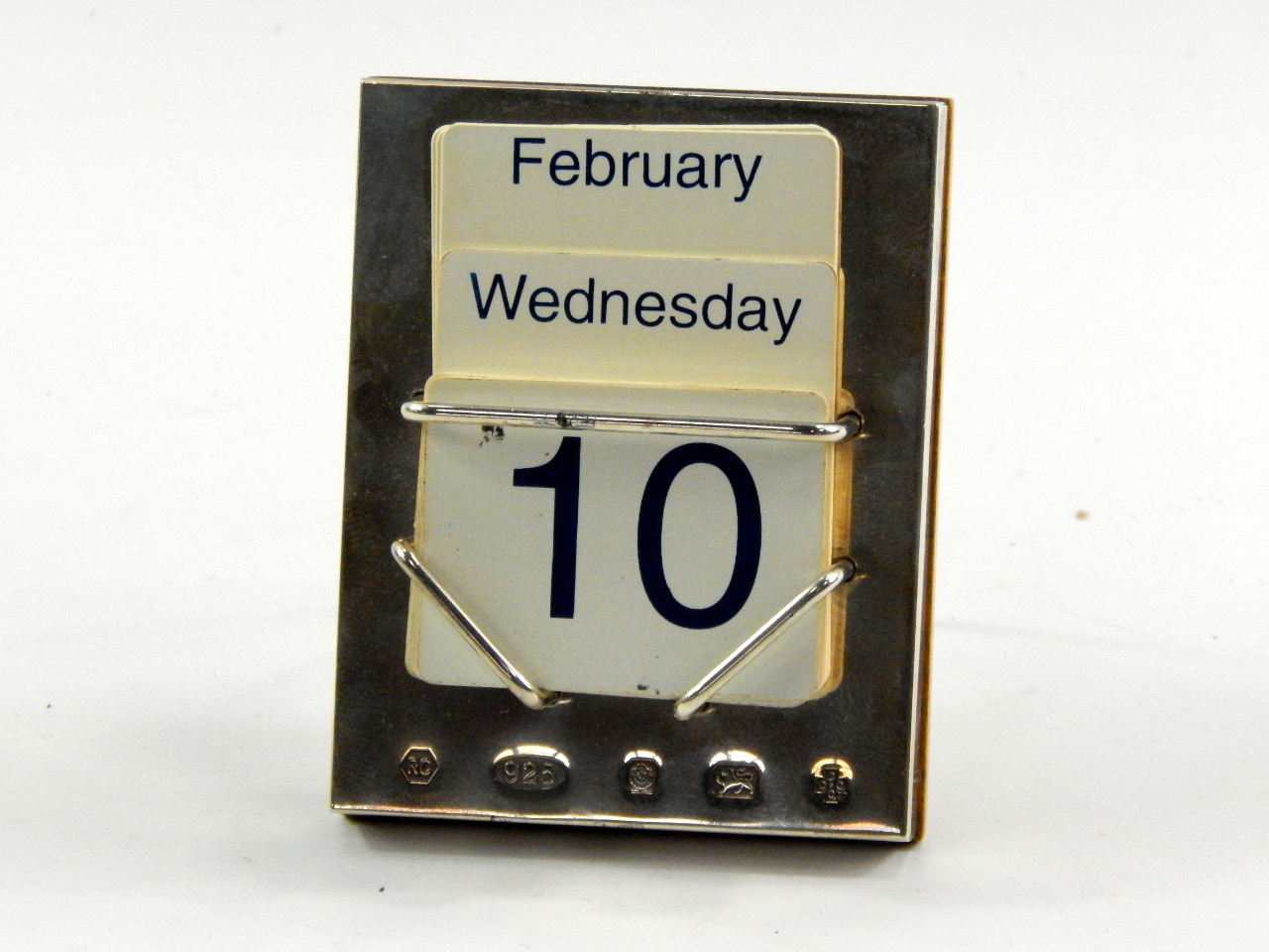 Appraisal: A silver backed perpetual calendar with easel back support Carrs