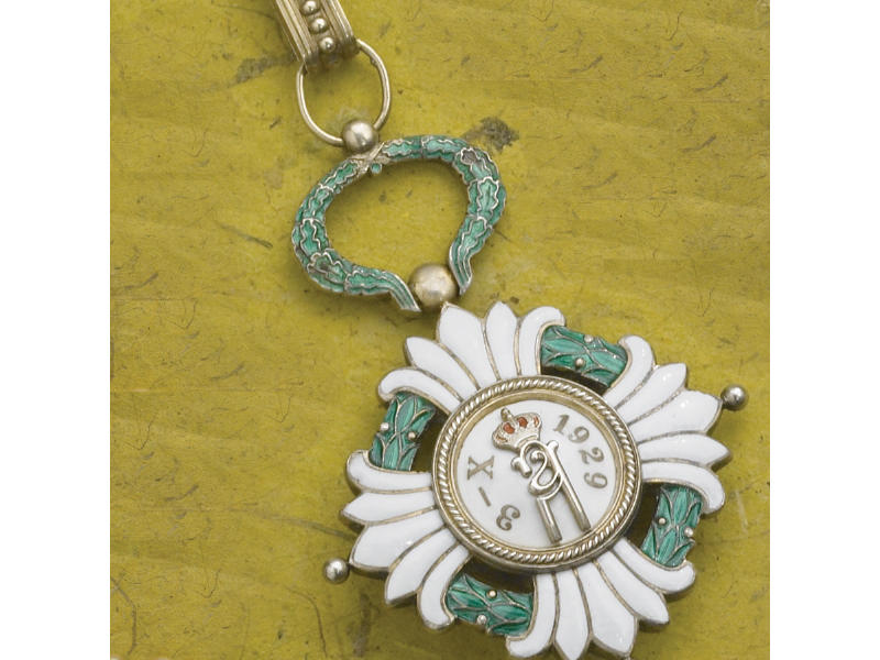 Appraisal: ENAMELED MEDALLION With royal crown design green and white enamel