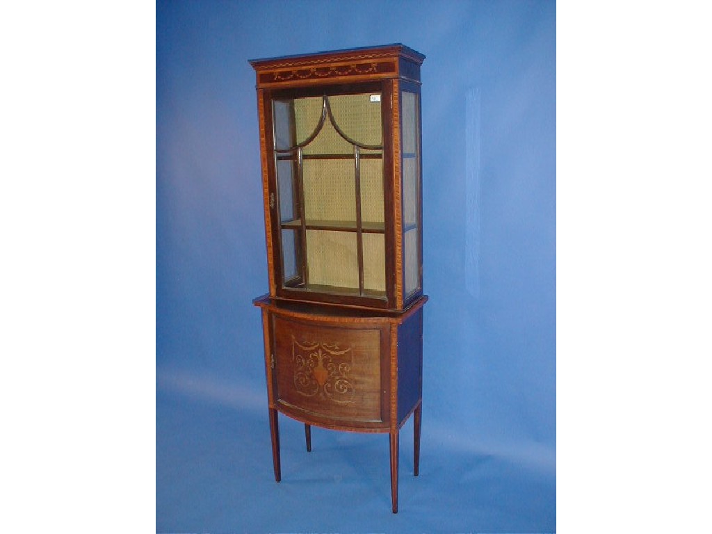 Appraisal: An Edwardian string inlaid and marquetry display cabinet with astragal