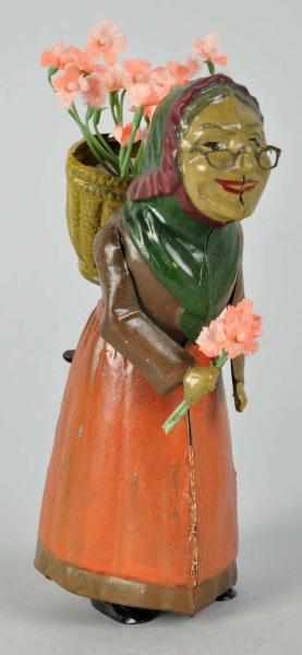 Appraisal: Handpainted Tin Woman Figure Wind-Up Toy German Marked DRGM on