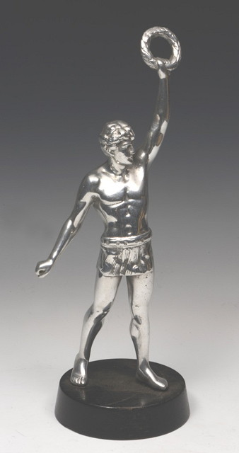 Appraisal: A WHITE METAL STATUE OF A OLYMPIAN HOLDING ALOFT A