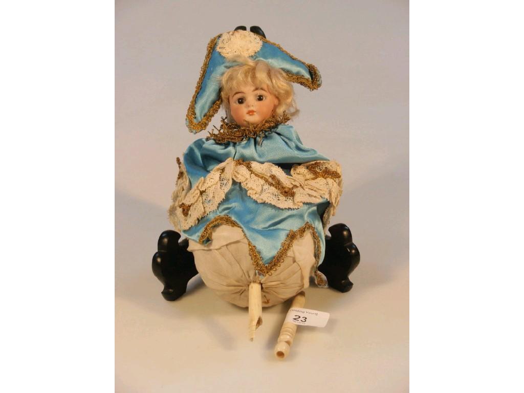 Appraisal: An early thC bisque headed doll automaton with an egg