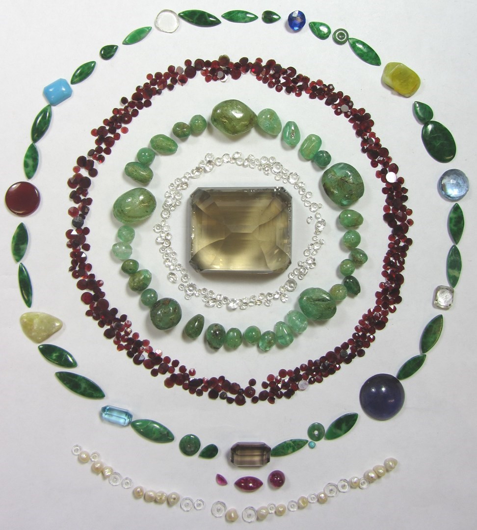 Appraisal: A group of unmounted gemstones including three cabochon rubies garnets