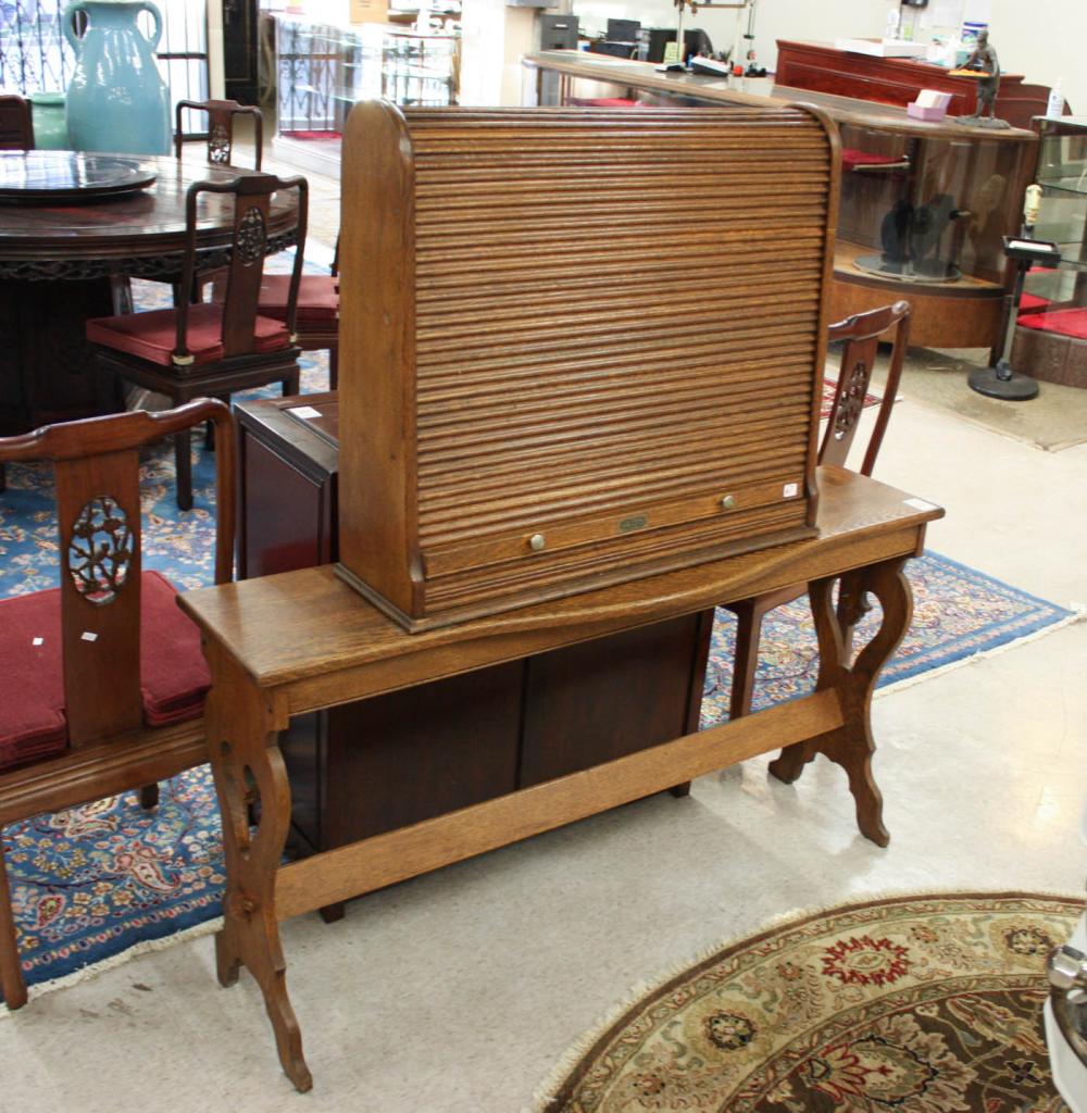 Appraisal: OAK TAMBOUR CABINET ON STAND American early th century The