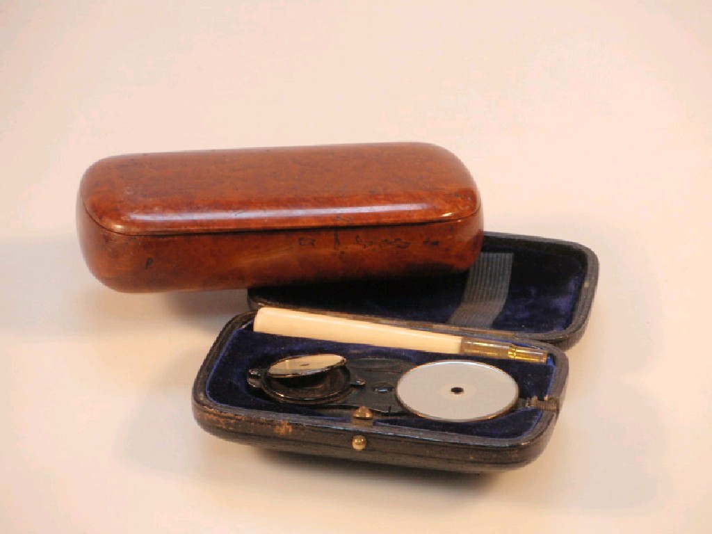 Appraisal: A Victorian ophthalmoscope in a black Morocco case together with