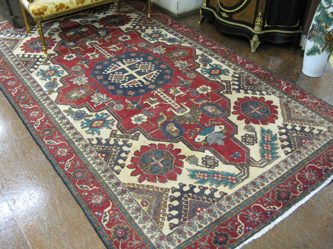 Appraisal: PERSIAN TABRIZ CARPET central geometric medallion and overall stylized floral