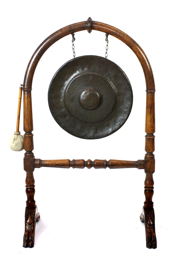 Appraisal: A Victorian oak and ash framed dinner gong with arch