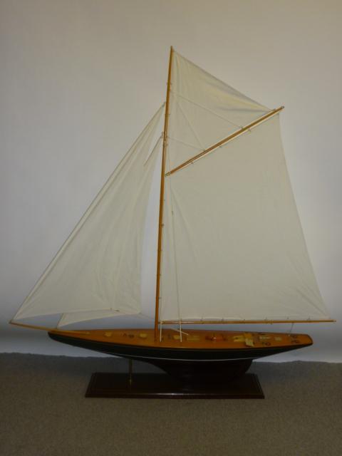 Appraisal: A model of a racing gaff cutter painted and varnished