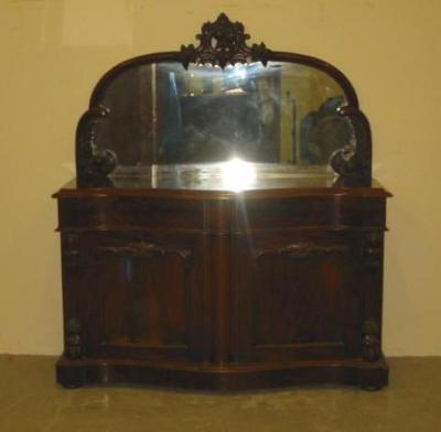 Appraisal: A VICTORIAN MAHOGANY CHIFFONIER of oblong serpentine form the arched