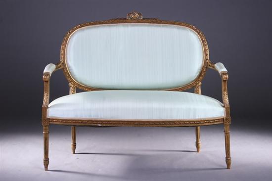 Appraisal: LOUIS XVI-STYLE GILTWOOD CANAPE Early th century Crested oval padded