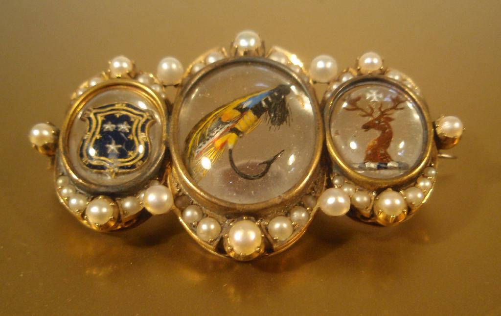 Appraisal: A Victorian brooch set with three Essex crystals the central