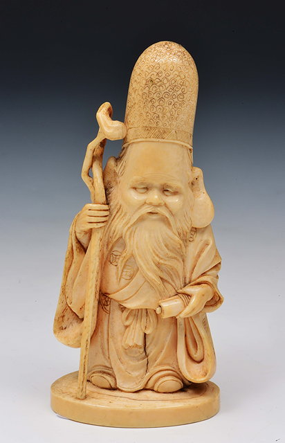 Appraisal: A Japanese ivory okimono of a standing FukurokojiuMeiji periodsigned Isshin