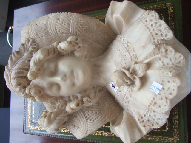 Appraisal: An alabaster bust of a woman after Poirent cm