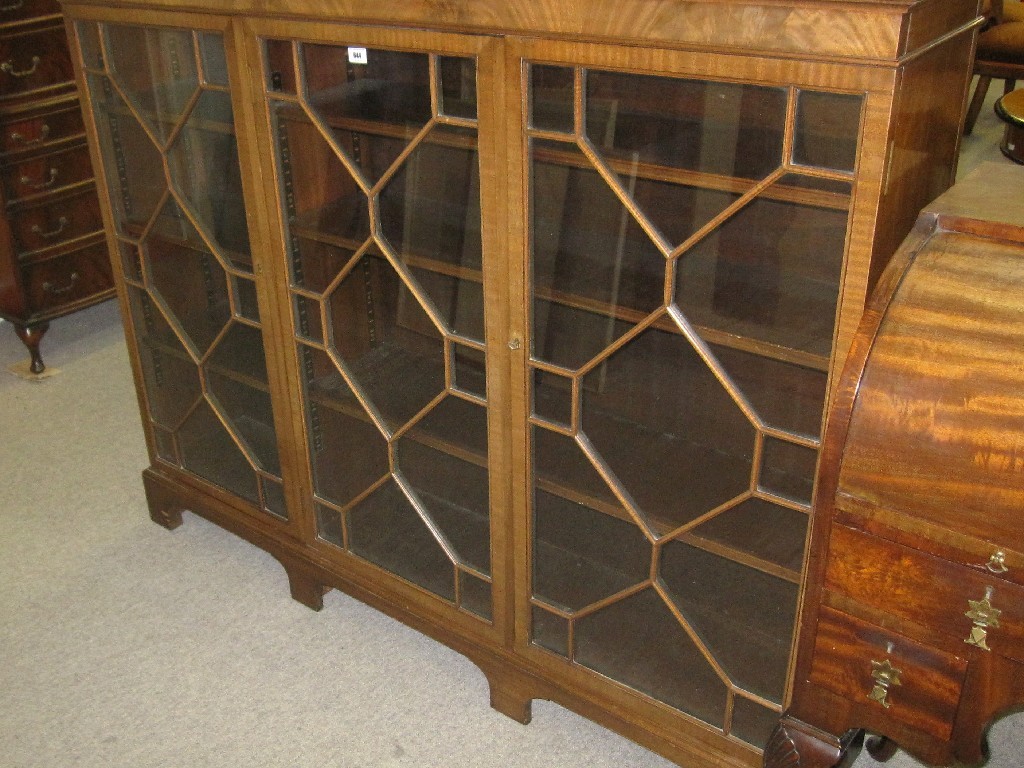 Appraisal: Mahogany and astragal glazed three door bookcase