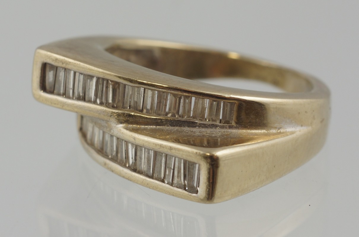 Appraisal: K WG retro diamond ring about tapered baguettes - pts