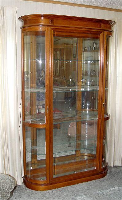 Appraisal: PULASKI STAINED MAHOGANY BOW SIDE DISPLAY CABINET Mirrored back interior