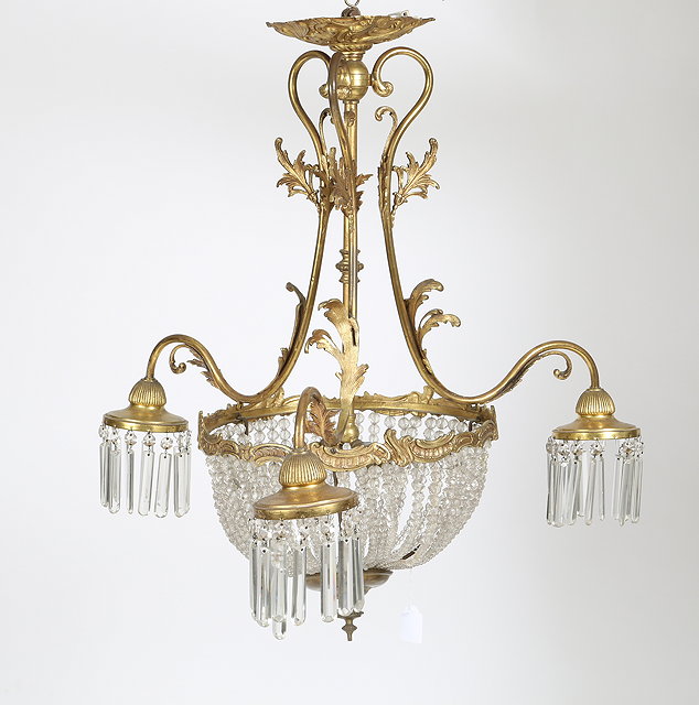 Appraisal: A GILT BRASS THREE BRANCH CEILING LIGHT with open acanthus