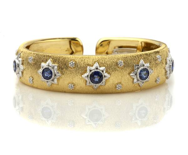 Appraisal: A sapphire and diamond cuff bangle bracelet hinged back estimated