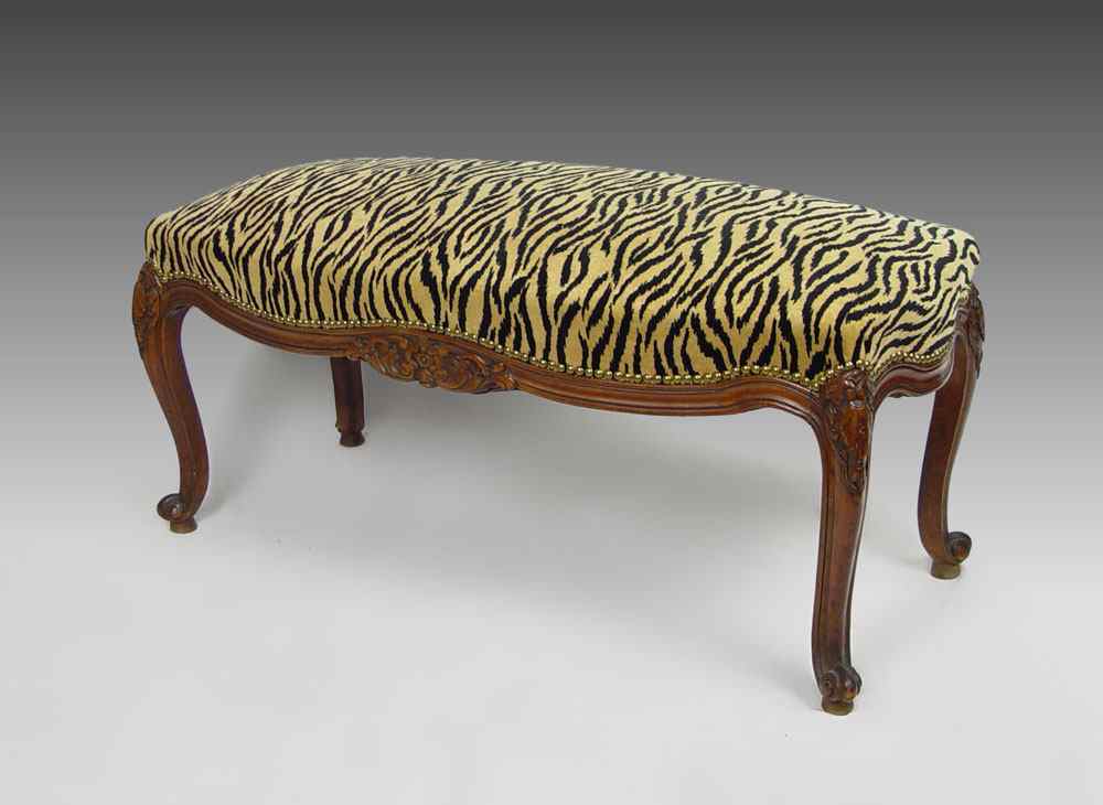 Appraisal: FRENCH STYLE CARVED WALNUT UPHOLSTERED BENCH SEAT Tiger fabric with