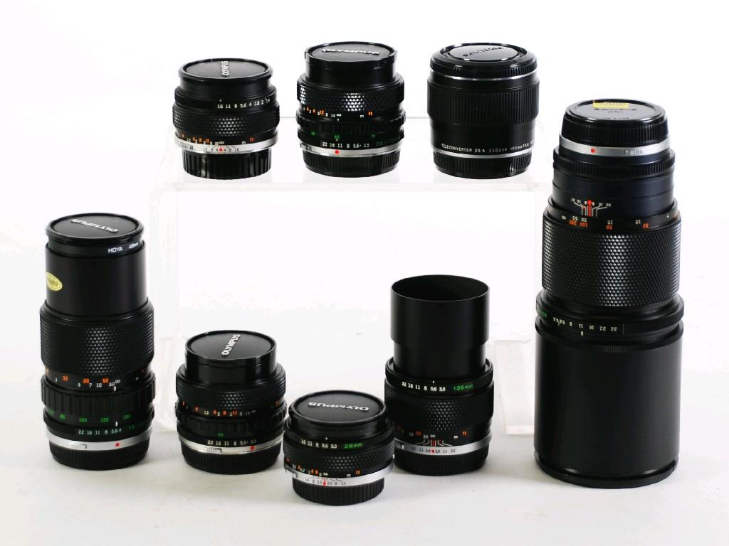 Appraisal: SEVEN OLYMPUS OM-SYSTEM ZUIKO LENSES comprising Auto - T mm