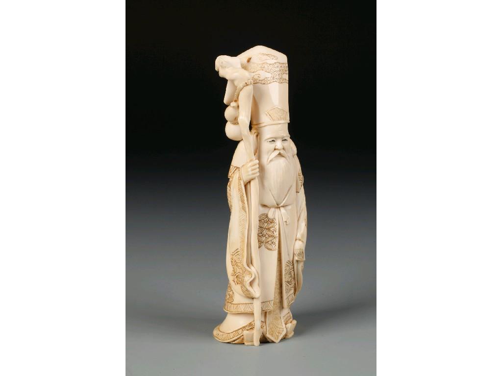 Appraisal: A JAPANESE IVORY OKIMONO of a sage holding a sceptre