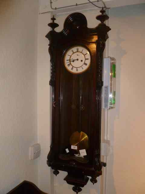 Appraisal: A TH CENTURY ROSEWOOD VIENNA WALL CLOCK with stylised cased