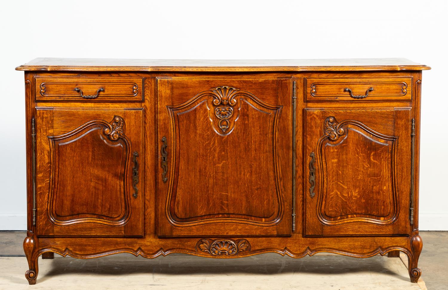 Appraisal: FRENCH PROVINCIAL LOUIS XV-STYLE OAK BUFFET French Provincial oak buffet