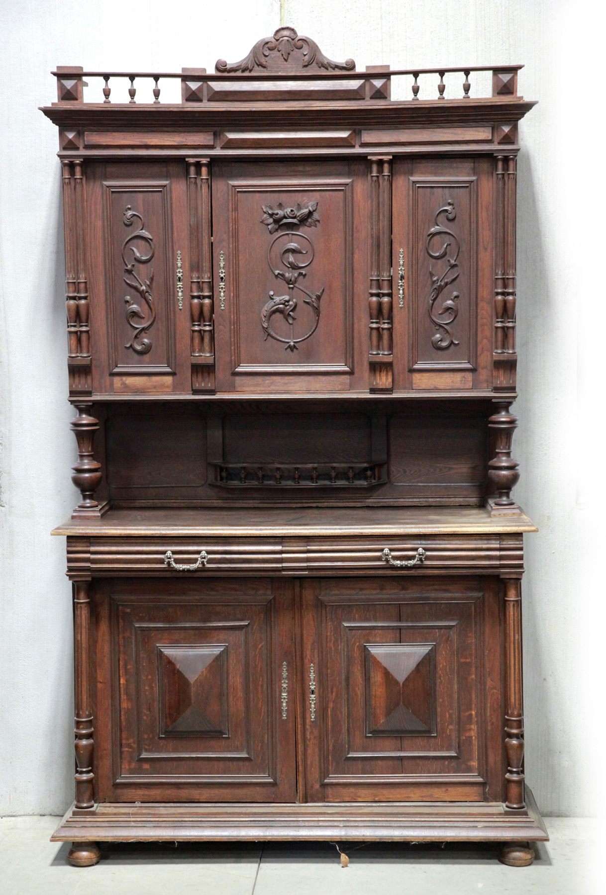 Appraisal: COURT-STYLE CUPBOARD England th quarter- th century Oak Baluster gallery