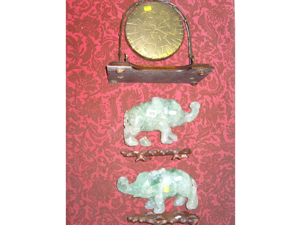 Appraisal: A pair of oriental carved models of elephants in the