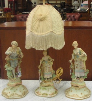 Appraisal: THREE PIECE MATCHING TABLE LAMP SET The figural lamp having