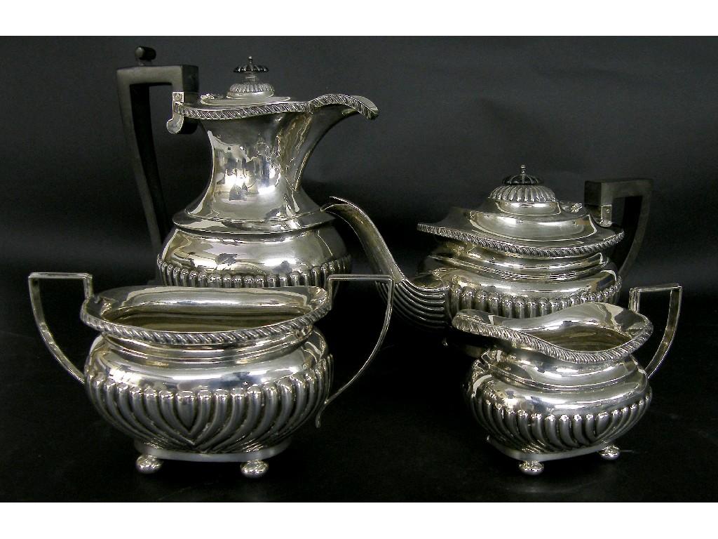 Appraisal: Good four piece Edwardian silver half fluted boat shaped tea