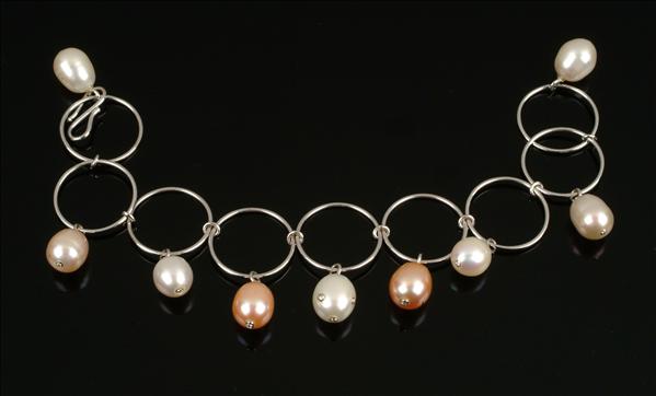 Appraisal: A freshwater cultured pearl and diamond bracelet designed as a