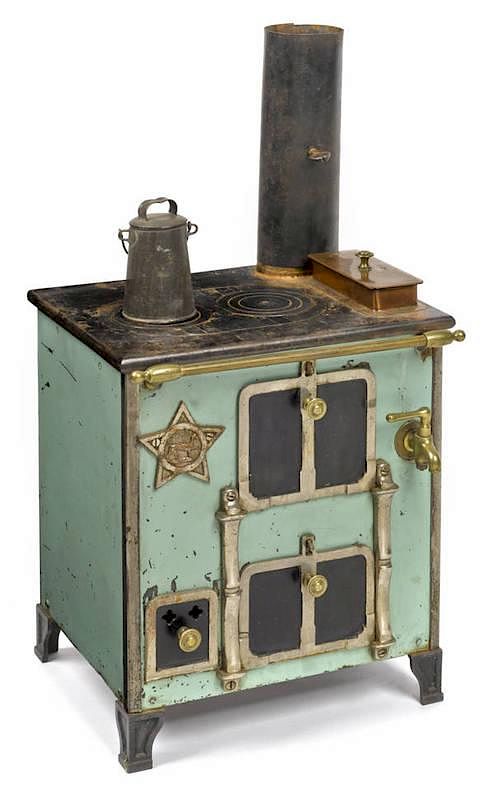 Appraisal: Cast iron nickel copper and enameled toy stove Cast iron