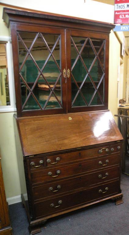 Appraisal: A George III mahogany bureau bookcase the top with a