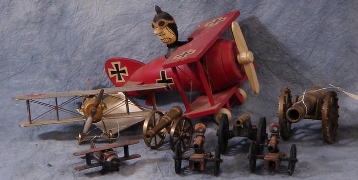 Appraisal: Three model biplanes along with cannon models Estimate -