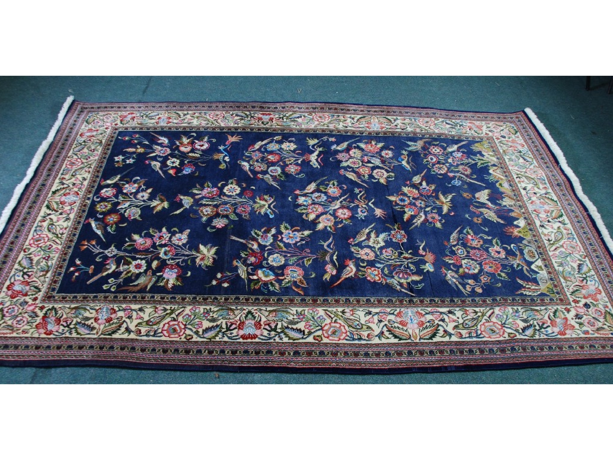 Appraisal: LARGE EASTERN RUG with a large repeat pattern of exotic