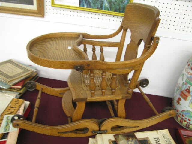 Appraisal: Victorian Oak Rocker Highchair Combination cane seat original wheels