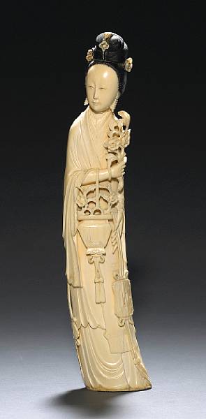 Appraisal: A carved ivory figure of a maiden th Century The