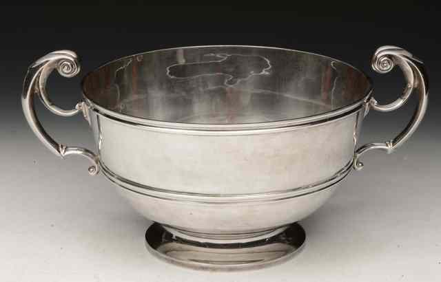 Appraisal: AN EDWARDIAN SILVER TWO HANDLED BOWL standing on a turned