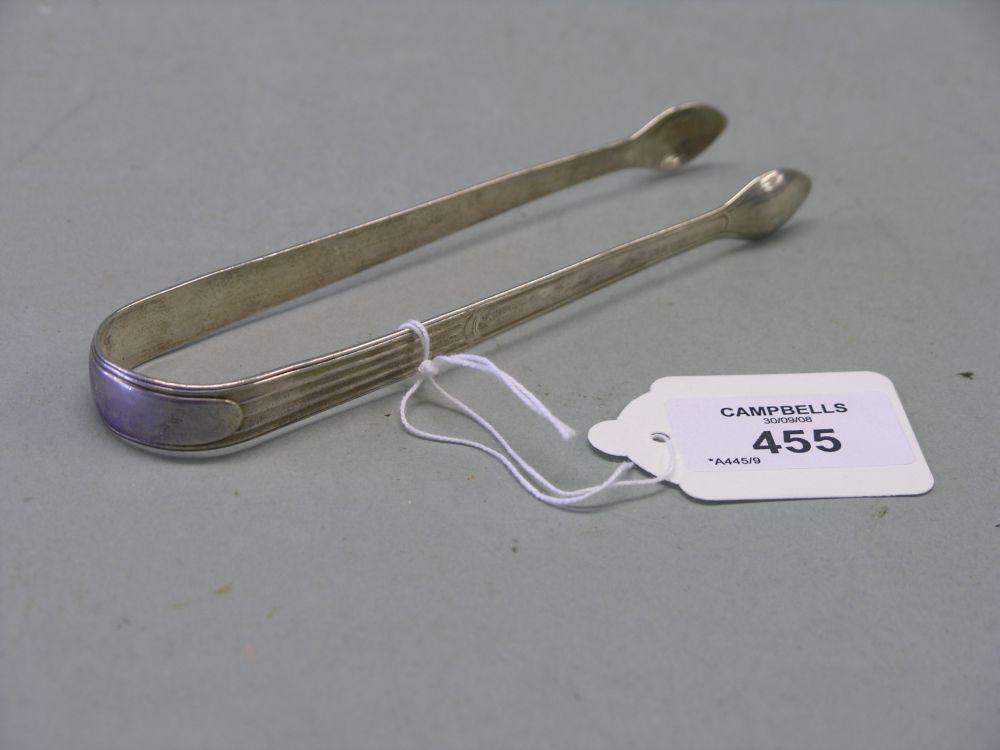 Appraisal: A pair of George III silver sugar tongs Peter Anne