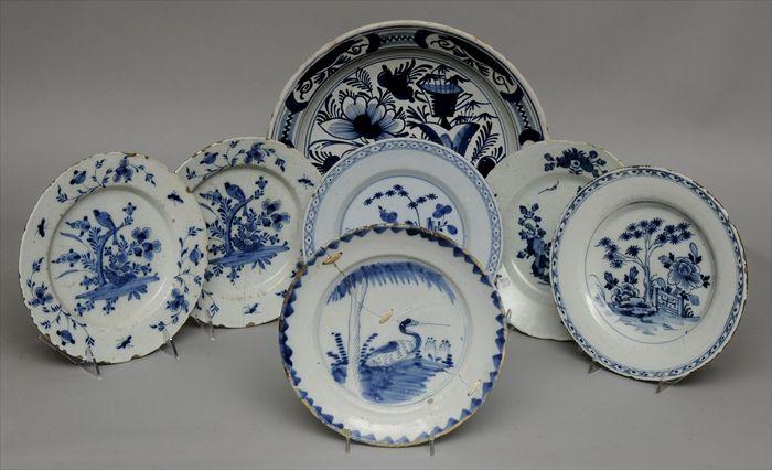 Appraisal: SIX DELFT BLUE AND WHITE PLATES AND A CHARGER The