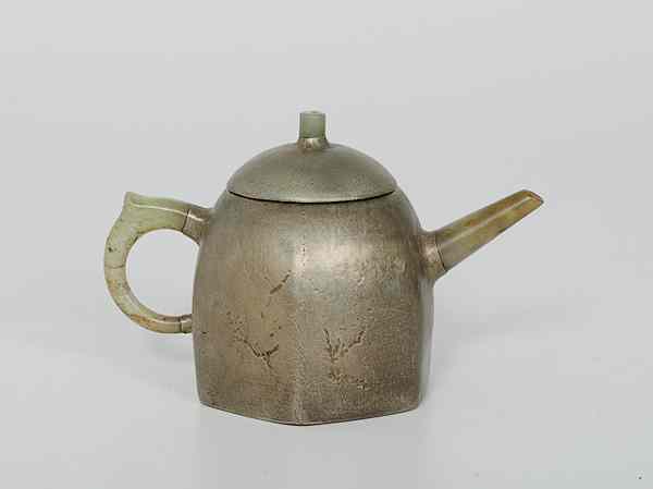 Appraisal: Chinese Teapot China A terracotta teapot covered in a silver